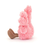 A plush toy resembling a pink coral with a smiling face and brown eyes