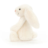 Cream plush bunny toy on a white background