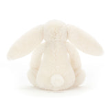 Cream plush bunny toy on a white background