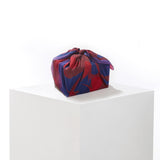 Colorful fabric wrap on a white surface