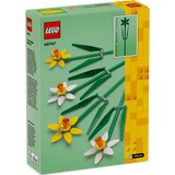 LEGO set packaging with flowers and greenery on a white background