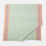 A cloth napkin in a striped pattern of green, orange and purple.
