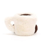 Plush toy espresso cup with a smiling face on a white background