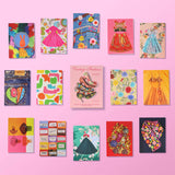 Assorted notecards with different fashion images on a pink background