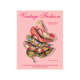 A box of vintage fashion-themed notecards featuring illustrations of colorful, patterned clothing and accessories on a pink background.
