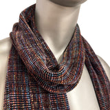 Multicolored scarf on a mannequin against a white background