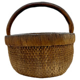Woven basket with a wooden handle on a white background