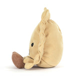 Plush toy ravioli with a smiling face on a white background