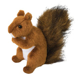 A plush toy resembling a red squirrel with a brown body, white belly, and a bushy tail with black tips.