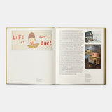 Open book with illustrations and text on a white background