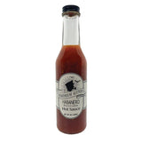 A jar of Habanero Hurricane Hot Sauce with a label that includes the brand name and product description.