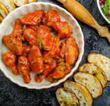 Chicken wings covered in hot sauce
