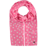 A pink scarf with white polka dots laid out flat.