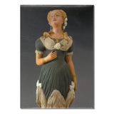 A magnet depicting a figurehead from the bark Marie, painted wood artwork of a woman in historical clothing.