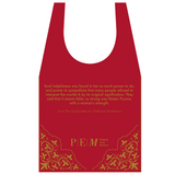 A tote bag with a geometric pattern featuring a prominent gold 'A' on a navy background, reflecting the cover design of Nathaniel Hawthorne's novel The Scarlet Letter.