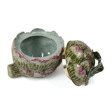 Artichoke shaped decorative box with lid off.