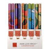 A set of five Frank Lloyd Wright Chopsticks in a white display box, each featuring a unique colorful Art Deco style pattern on the upper half and a white lower half with the brand name printed in red.