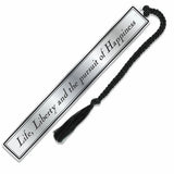 Metal bookmark with 'Life, Liberty and the pursuit of Happiness' text and black tassel on a white background