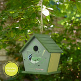 Green birdhouse with a bird illustration on a tree branch, featuring Charley Harper branding.
