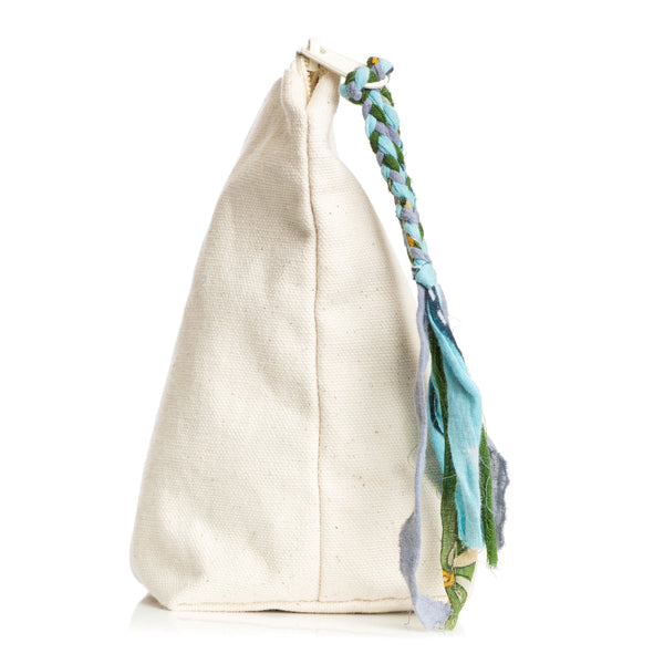 Beige zippered bag with a colorful braided handle on a white background