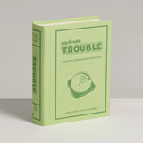 Green book-shaped product with 'papomatic Trouble' branding on a gray background