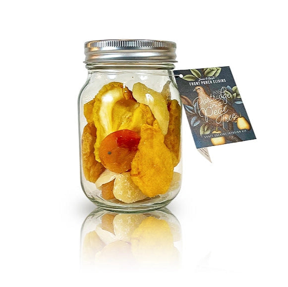 Glass jar filled with dried fruits and a label on a white background