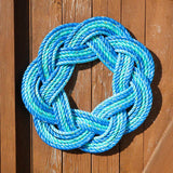 Blue rope knot wreath on a wooden door