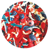 Assorted colorful gummy fish on a white background