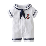 White baby romper with navy accents and an anchor design on a white background