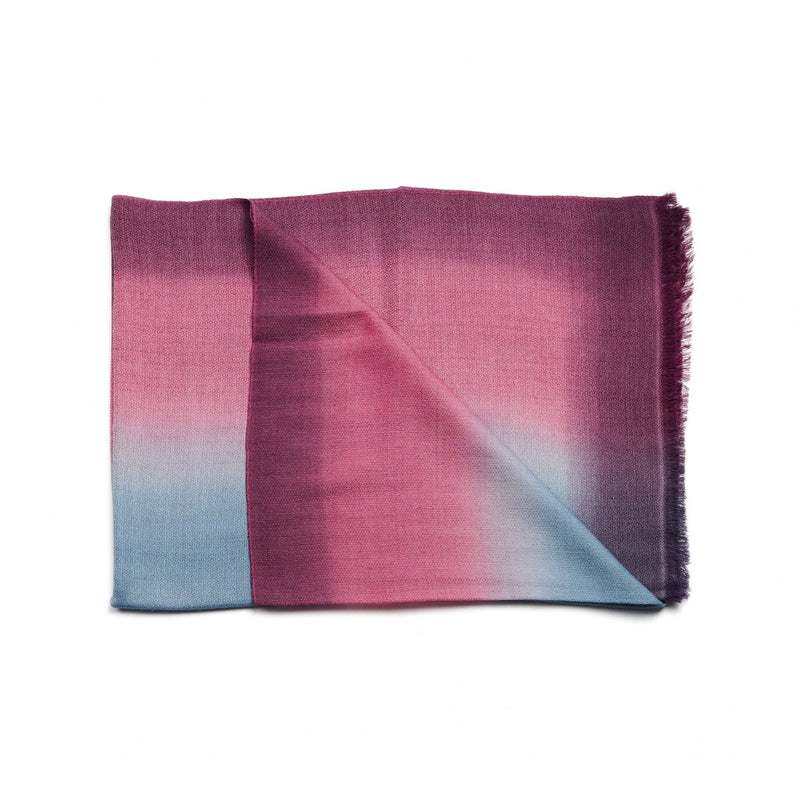 Gradient scarf transitioning from pink to blue on a white background