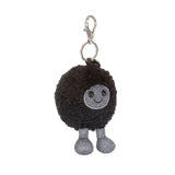 Black plush keychain with a smiling face on a white background
