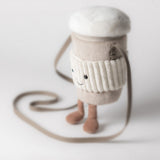 Plush bag resembling a cup with a smiling face on a white background