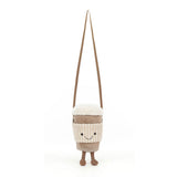Plush bag resembling a cup with a smiling face on a white background