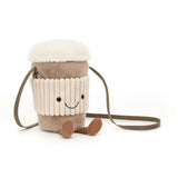 Plush bag resembling a cup with a smiling face on a white background