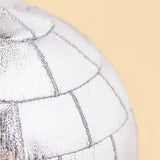 Close up detail of a disco ball bag charm