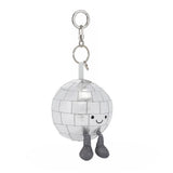 A silver disco ball keychain charm with a cute embroidered smiley face and small glittery gray legs, attached to a silver metal key ring on a white background.
