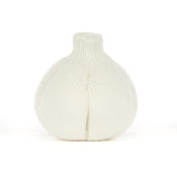 A knitted garlic plush toy in off-white with olive green feet and a simple embroidered smiley face, photographed on a clean white background.