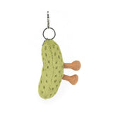 Green textured pickle keychain with a brown legs on a white background