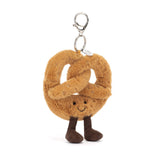 Plush pretzel-shaped keychain with a smiling face on a white background