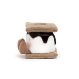 Plush toy resembling a s'more with marshmallows and chocolate on a white background