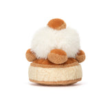 Small plush toy with a white top on a white background