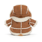 A plush teddy bear wearing a brown and cream winter coat with a matching cream fur-trimmed hat, seated against a plain white background.