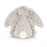 Gray plush bunny toy on a white background