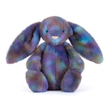 Multicolored plush bunny toy on a white background