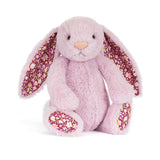 Pale purple plush bunny with floral ears and feet on a white background