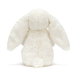 White plush bunny toy on a white background