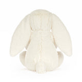 White plush bunny toy on a white background