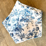Floral-patterned fabric on a wooden surface