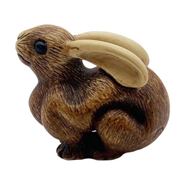 Rabbit netsuke, or Japanese toggle figurine on a white background