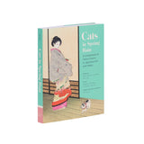A book titled "Cats in Spring Rain" standing upright on a white background. The cover features a vintage-style illustration of a woman in a kimono standing in a room with a small cat at the bottom right.